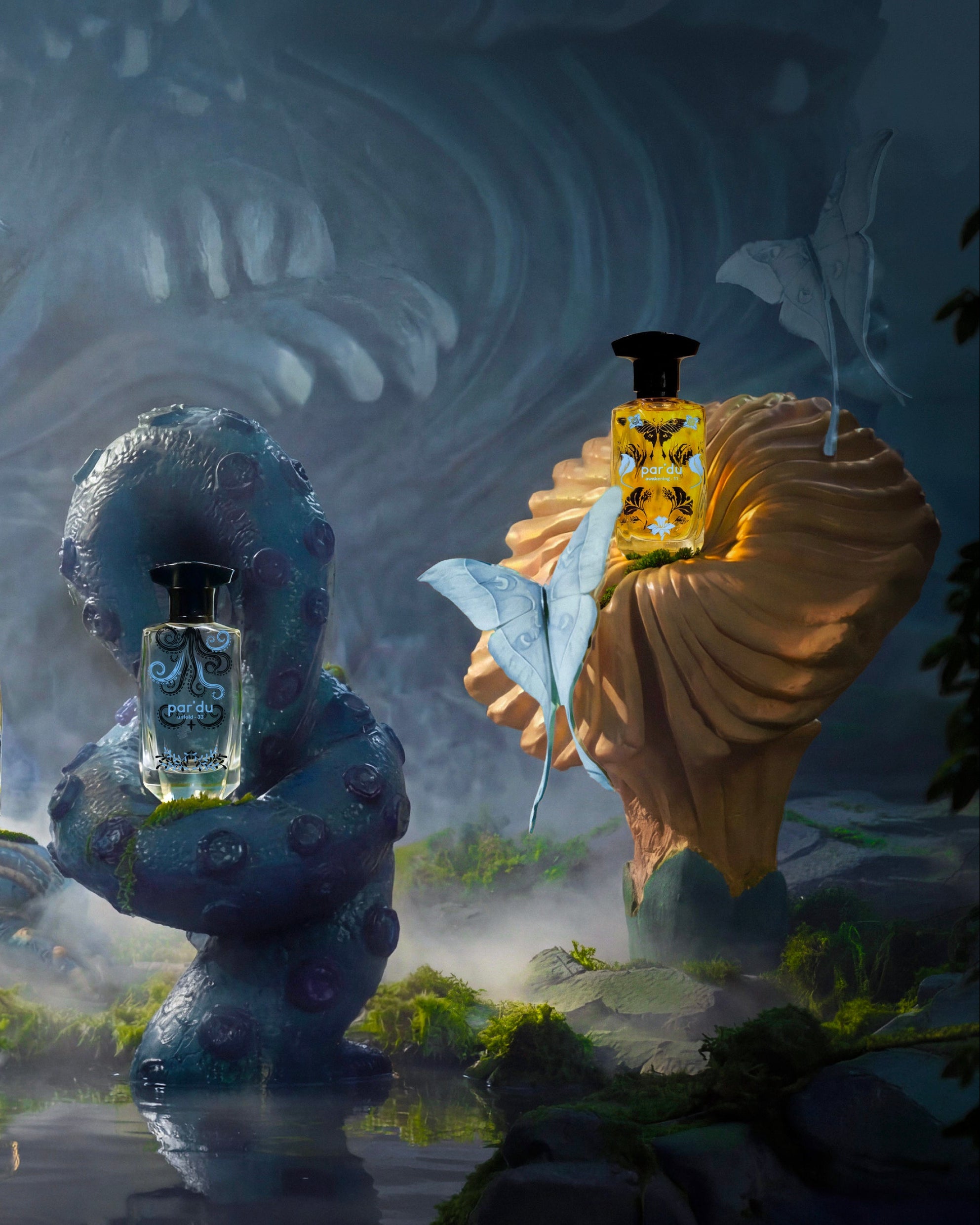 A surreal, moody product display featuring multiple perfume bottles placed on sculptural props in a misty, fantasy-like outdoor scene. The bottles are clear glass with yellow and amber liquids and black caps, surrounded by a large shell, a blue stone figure, and reflective water.