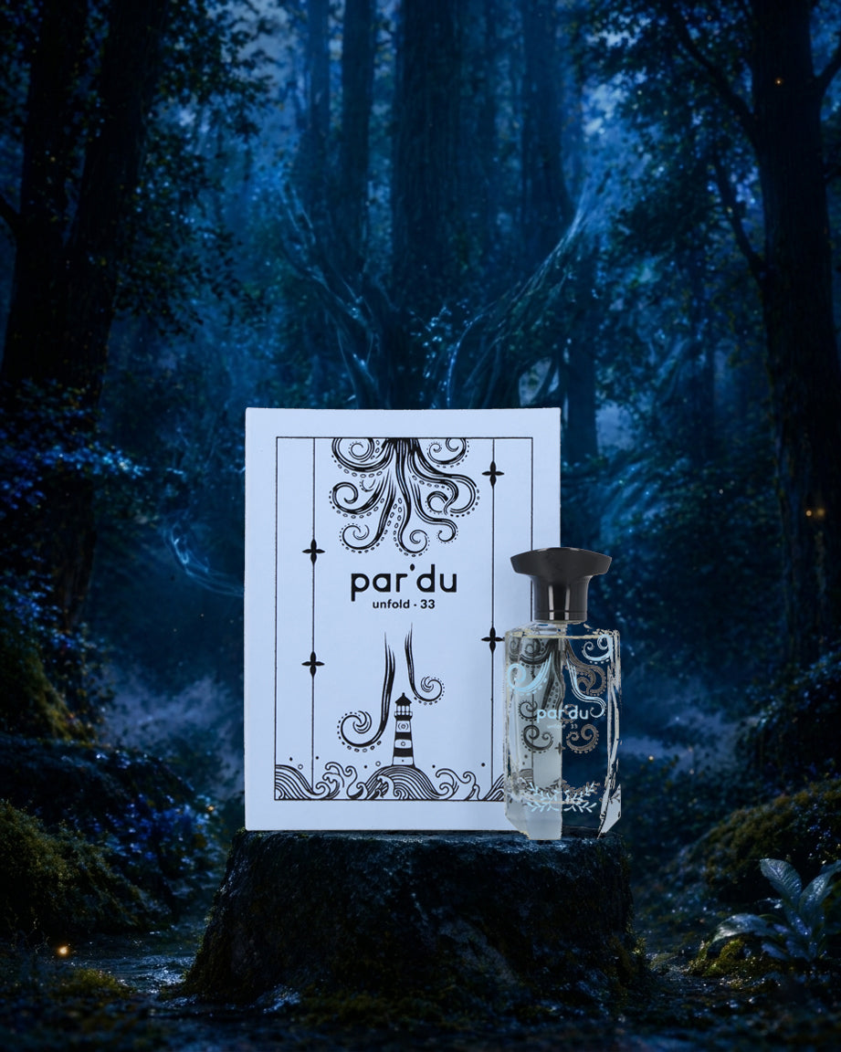 Perfume bottle and packaging with 'paréÑ' branding against a mystical forest background